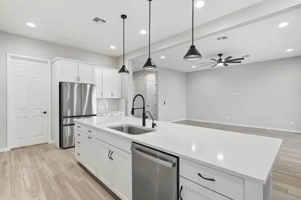 a backyard of a house with lots of green space and outdoor seating