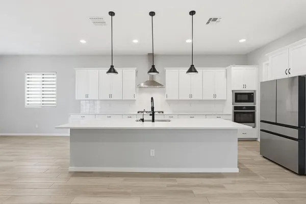 a view of a house with backyard porch and garden