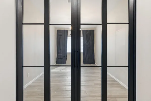 a bathroom with double vanity sinks and a mirror