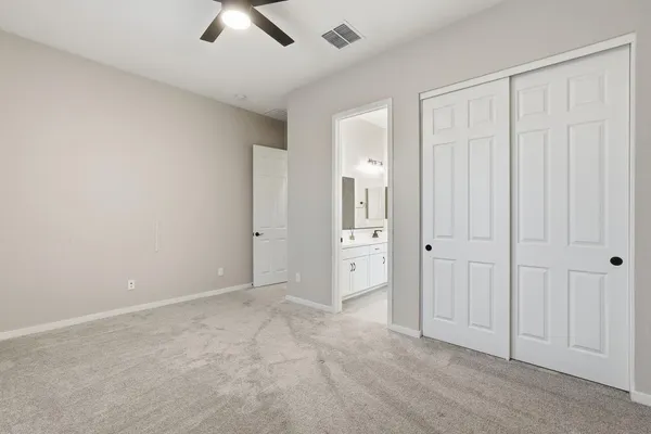 an empty room with closet area