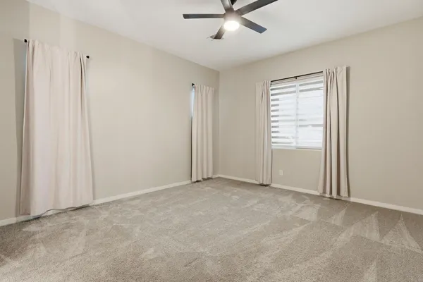 an empty room with fan