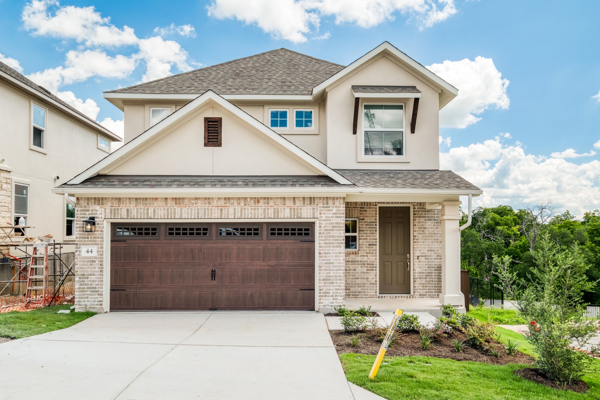 2605 Sam Bass Road, Unit 44 Round Rock, TX 78681 - Photo 1 of 26 A brand new corner lot & greenbelt residence, 3/2.5 showcasing a harmonious blend of brick and stucco with an attached garage.