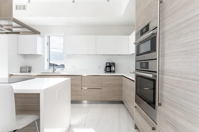 a kitchen with cabinets and appliances