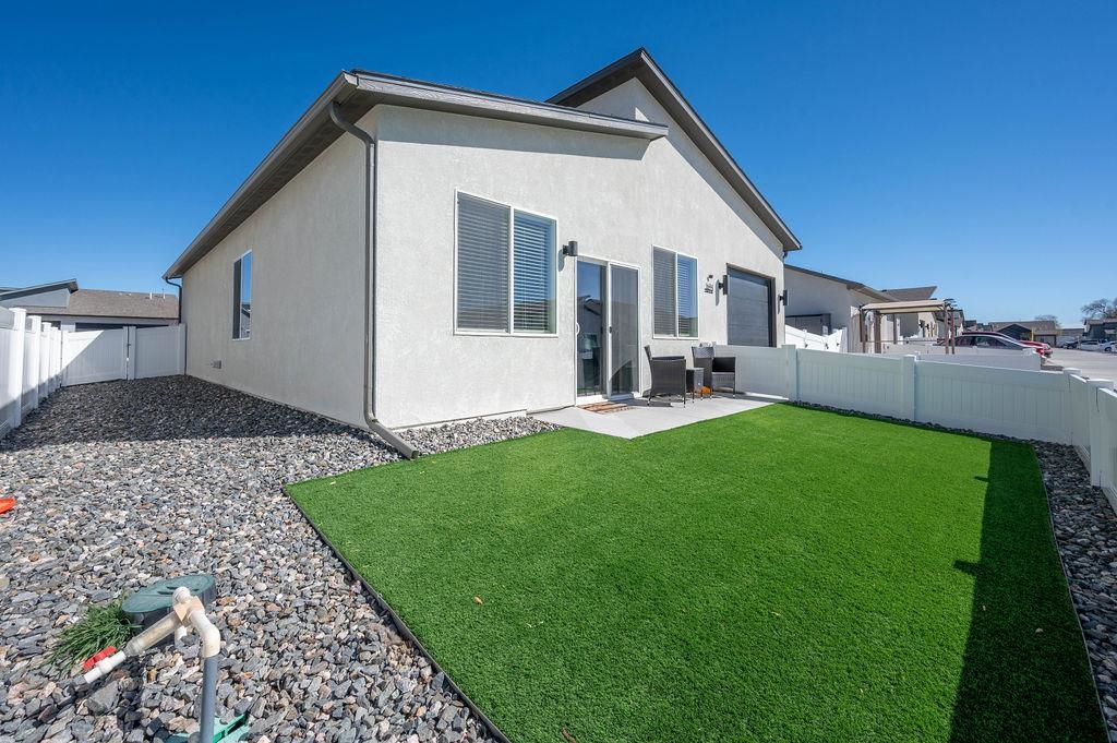 1694 Tungsten Way Fruita, CO 81521 - Photo 21 of 22 a front view of a house with garden