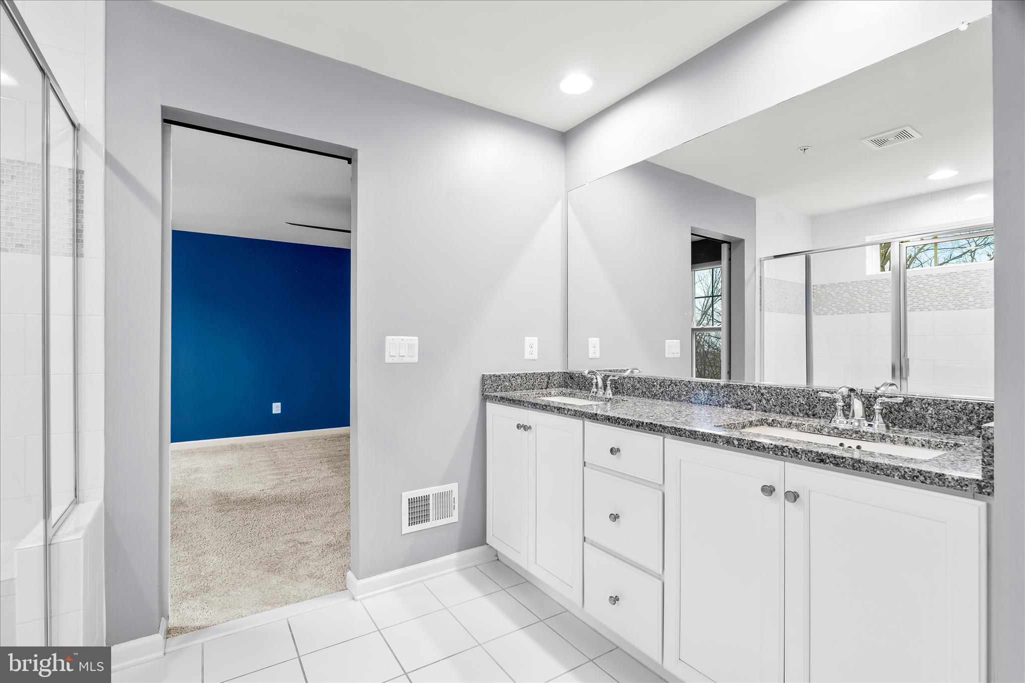 5642 Scott Ridge Place Frederick, MD 21704 - Photo 7 of 7 a bathroom with a granite countertop sink and a mirror