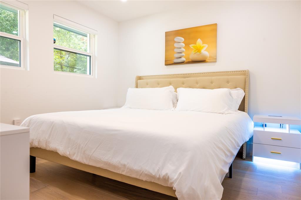 1402 Braes Ridge Drive, Unit B Austin, TX 78723 - Photo 6 of 13 a bedroom with a bed and window