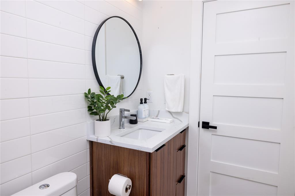 1402 Braes Ridge Drive, Unit B Austin, TX 78723 - Photo 8 of 13 a bathroom with a sink and a mirror