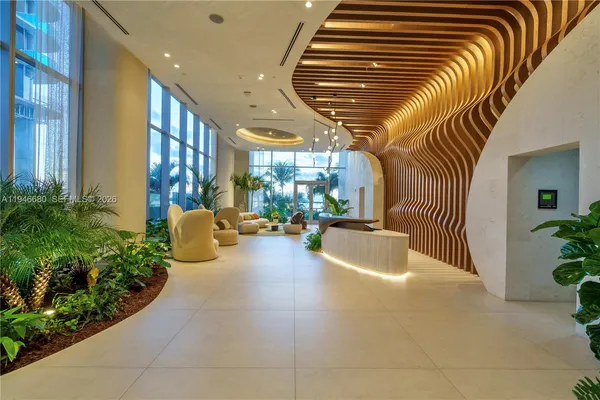 a swimming pool with outdoor seating and plants