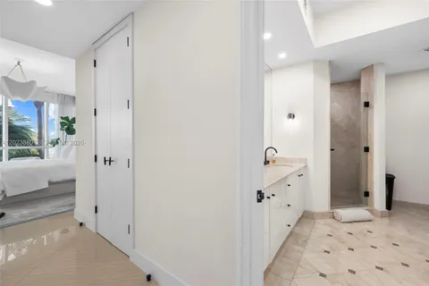a bathroom with a double vanity sink and mirror