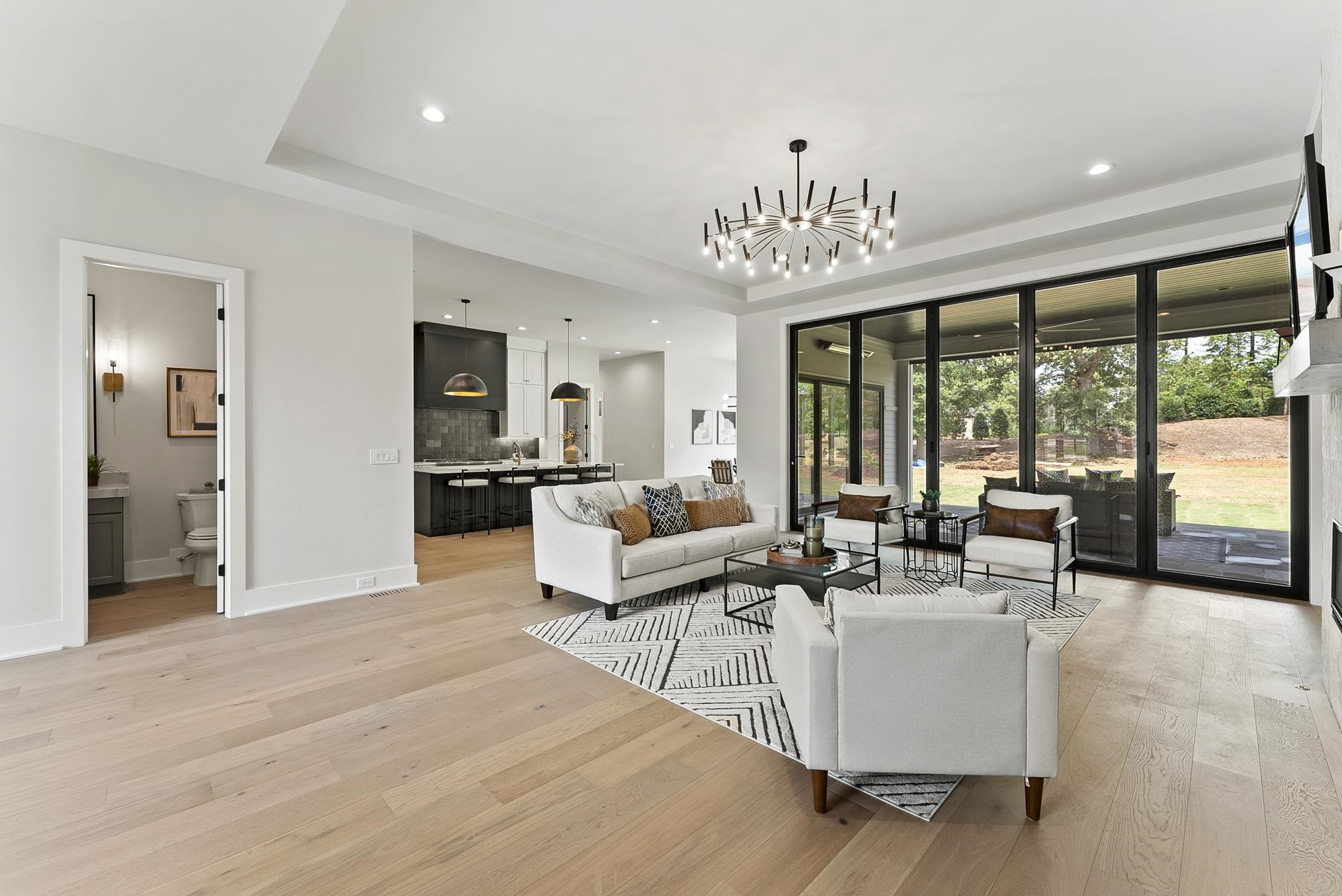 1001 Enchanted Pine Lane Raleigh, NC 27614 - Photo 12 of 52 a living room with furniture and large windows