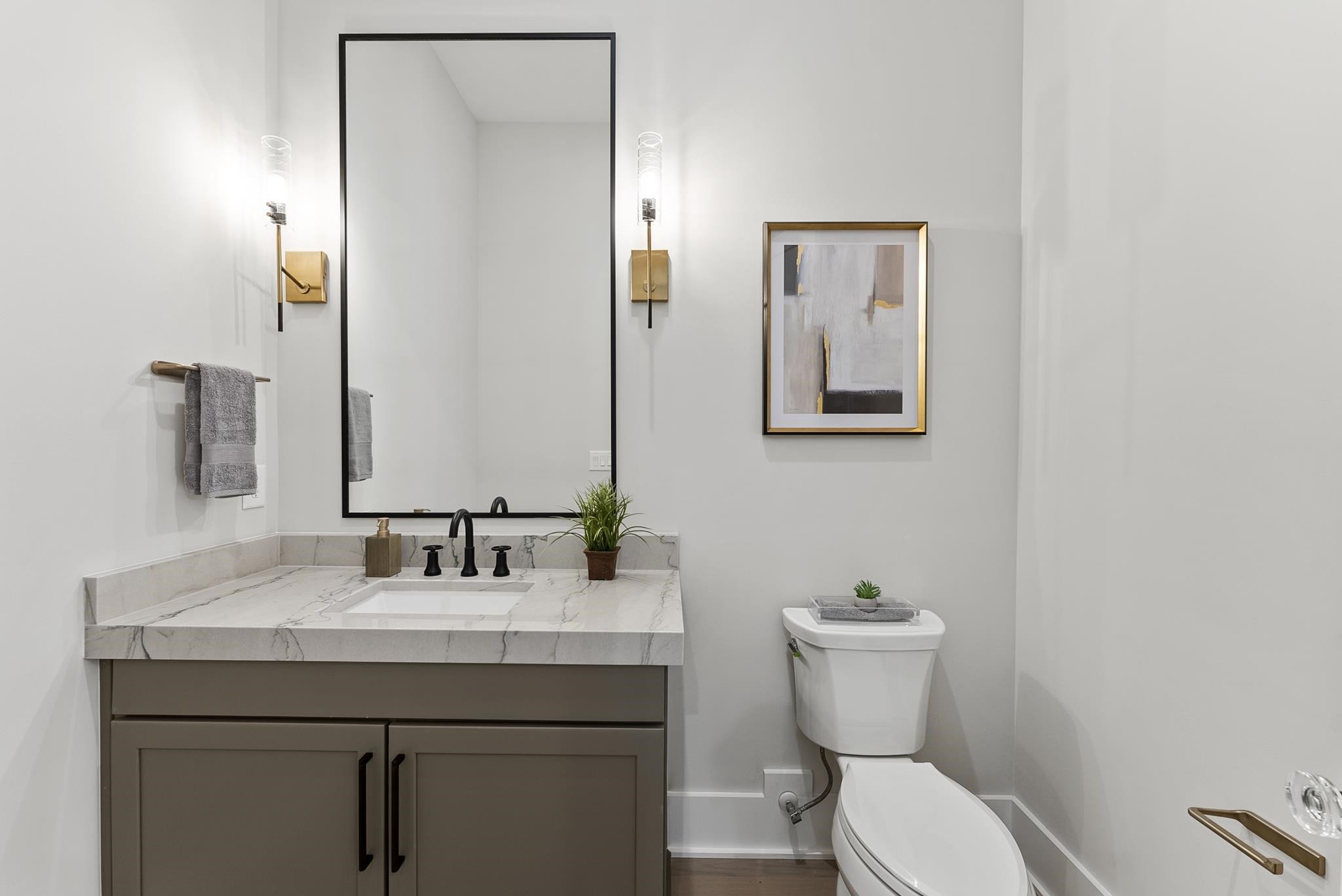 1001 Enchanted Pine Lane Raleigh, NC 27614 - Photo 13 of 52 a bathroom with a toilet a sink and mirror