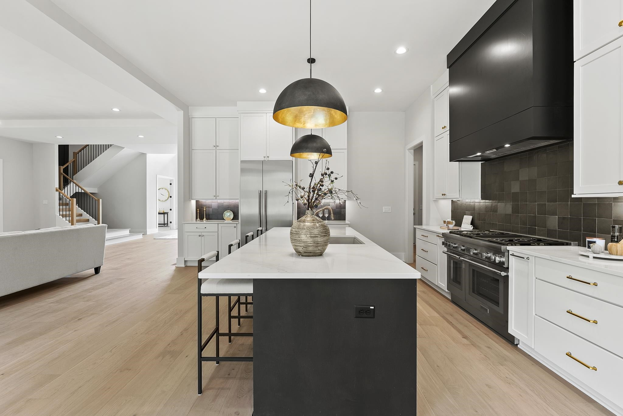 1001 Enchanted Pine Lane Raleigh, NC 27614 - Photo 18 of 52 a kitchen with a table chairs stove and cabinets
