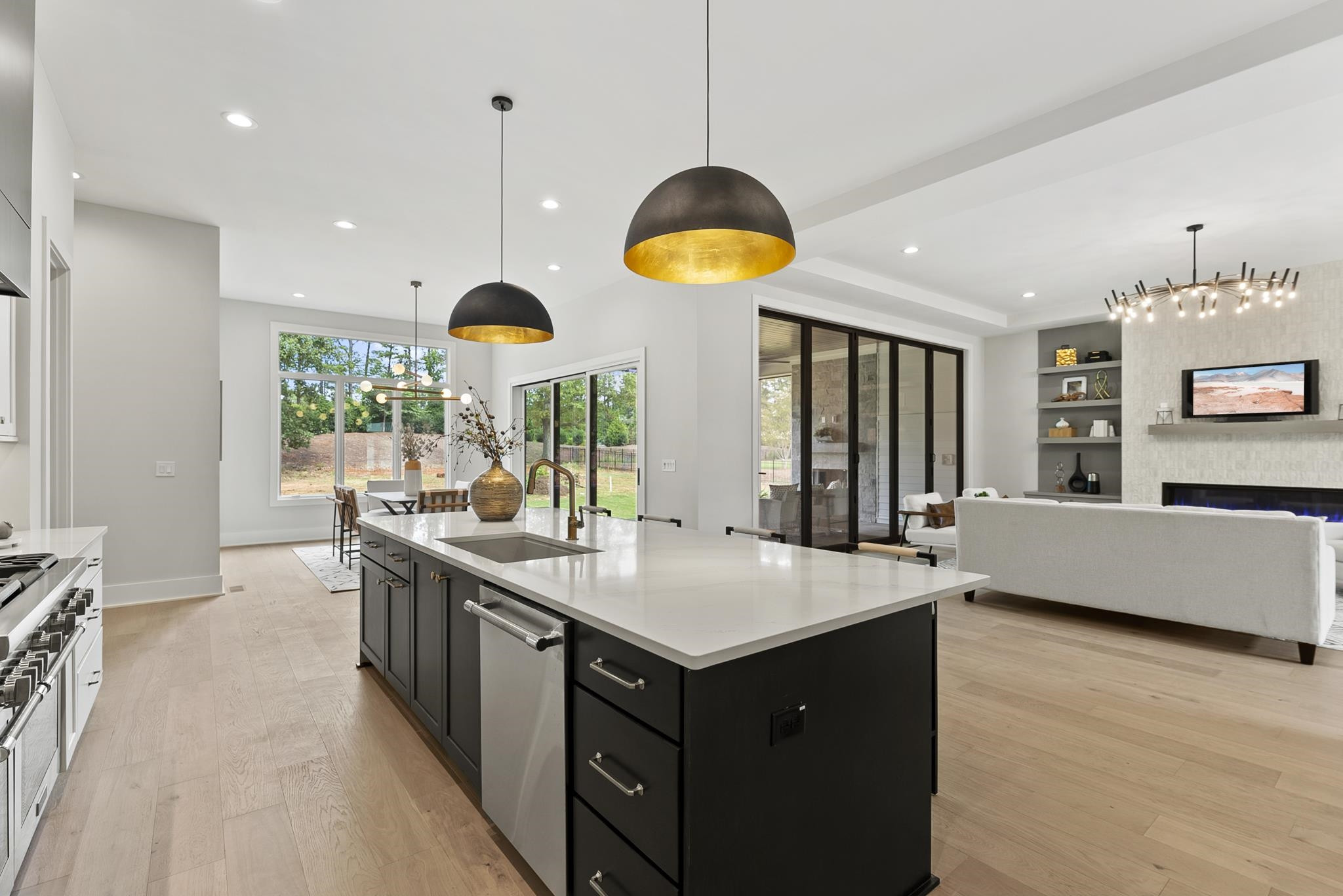 1001 Enchanted Pine Lane Raleigh, NC 27614 - Photo 21 of 52 a kitchen with stainless steel appliances granite countertop a sink a stove and a wooden floors
