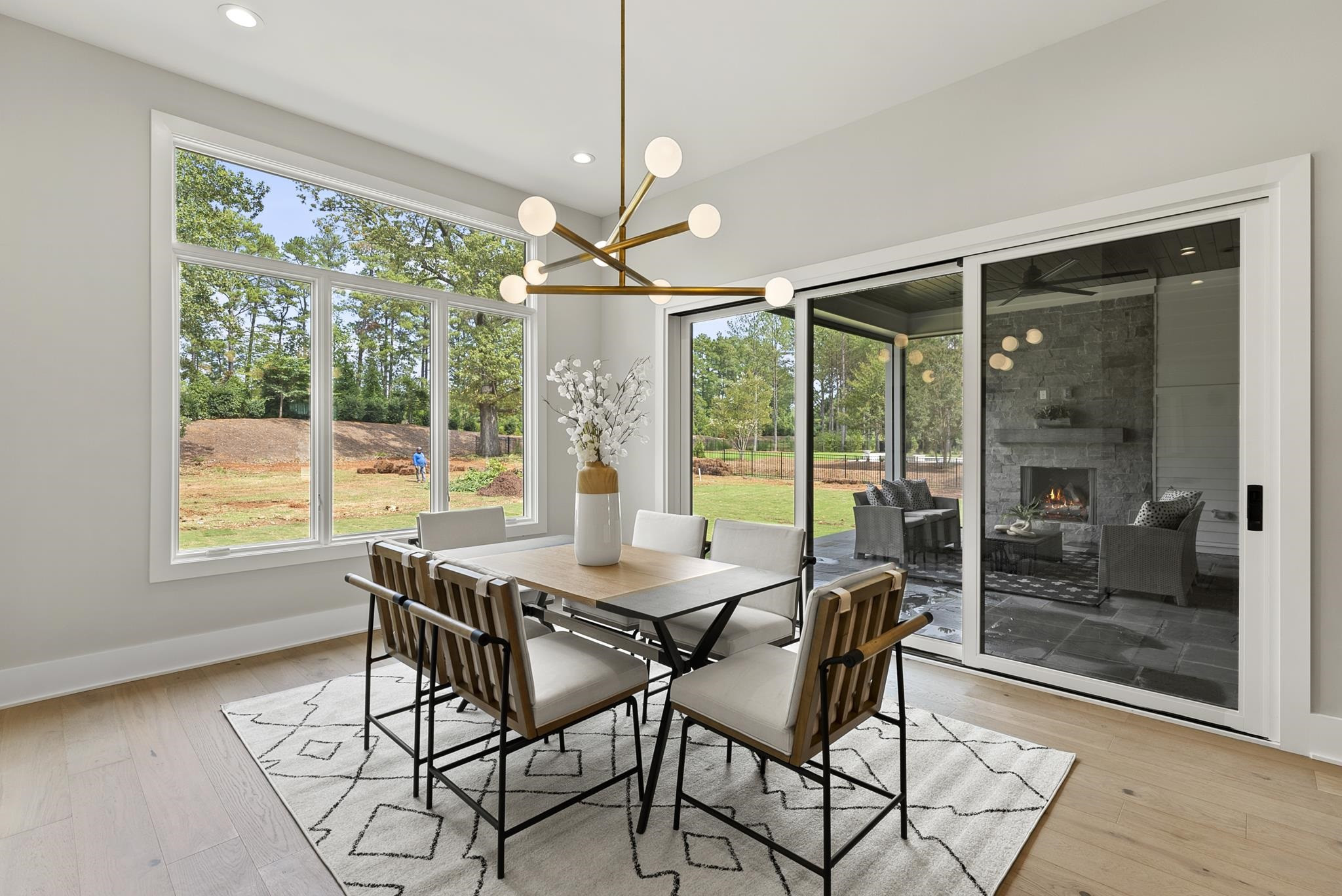 1001 Enchanted Pine Lane Raleigh, NC 27614 - Photo 25 of 52 a view of a dining room with furniture large windows and wooden floor