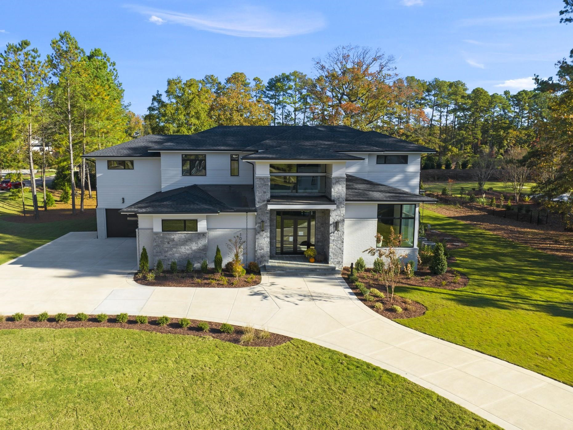 1001 Enchanted Pine Lane Raleigh, NC 27614 - Photo 3 of 52 a front view of a house with a yard