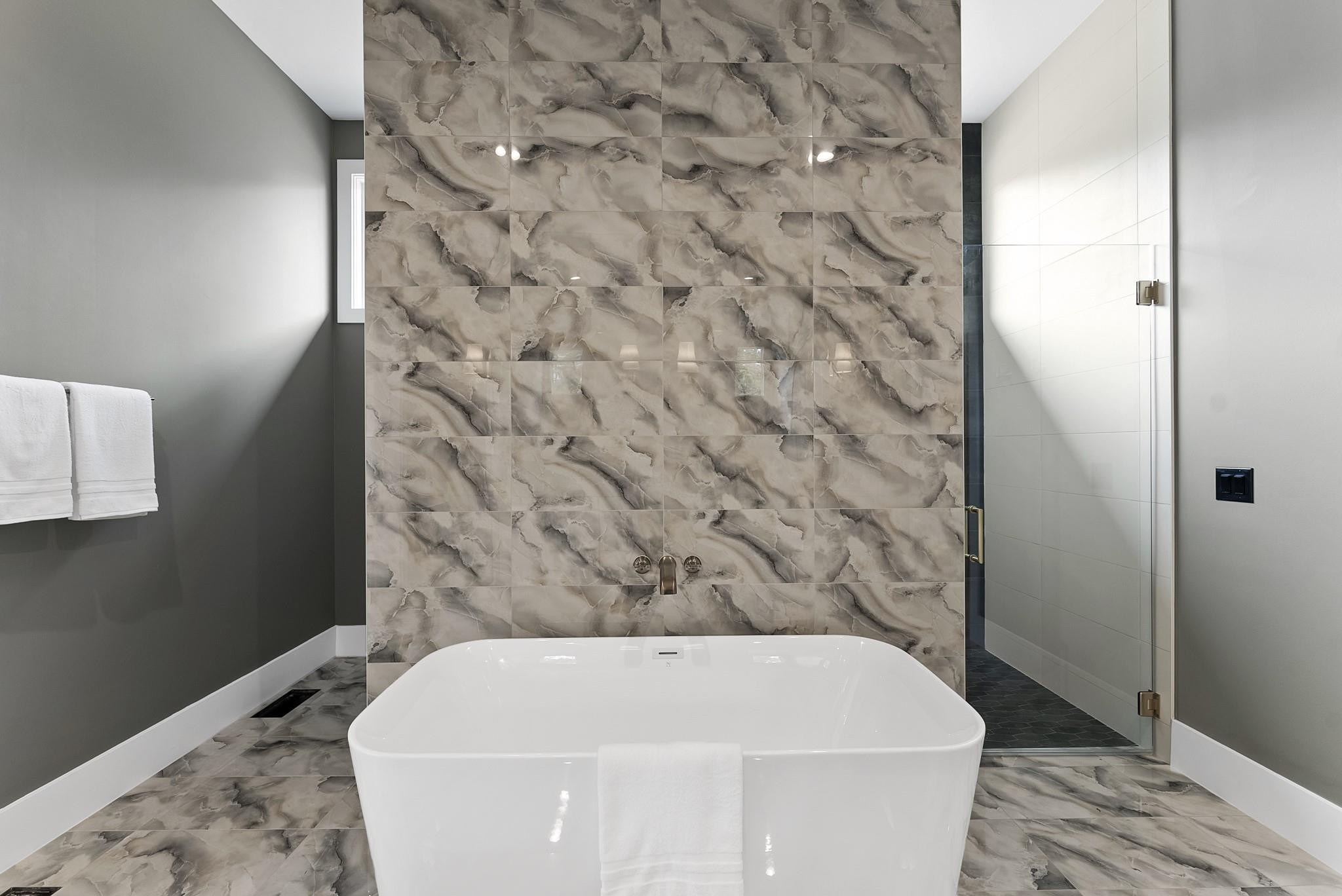 1001 Enchanted Pine Lane Raleigh, NC 27614 - Photo 31 of 52 a bathroom with a bathtub