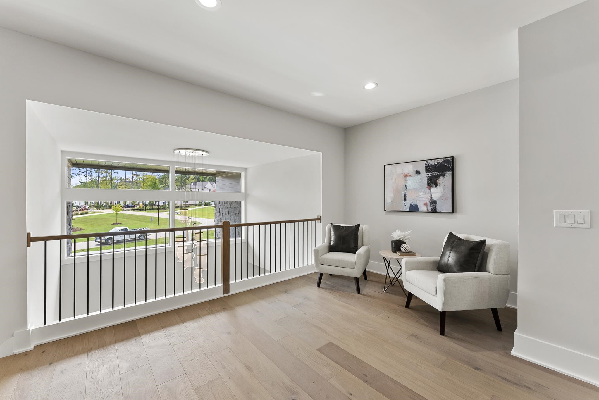 1001 Enchanted Pine Lane Raleigh, NC 27614 - Photo 39 of 52 a living room with furniture and a wooden floor