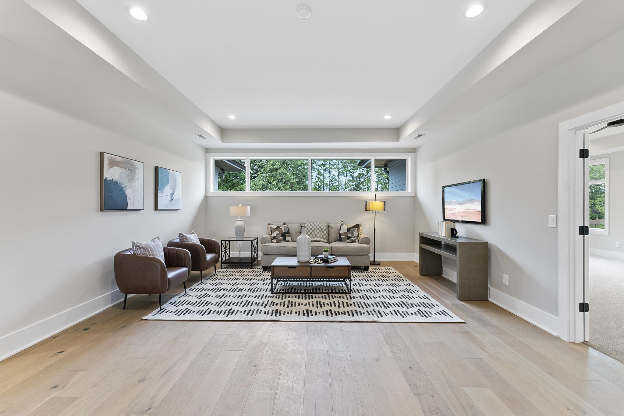 1001 Enchanted Pine Lane Raleigh, NC 27614 - Photo 40 of 52 a living room with furniture and wooden floor