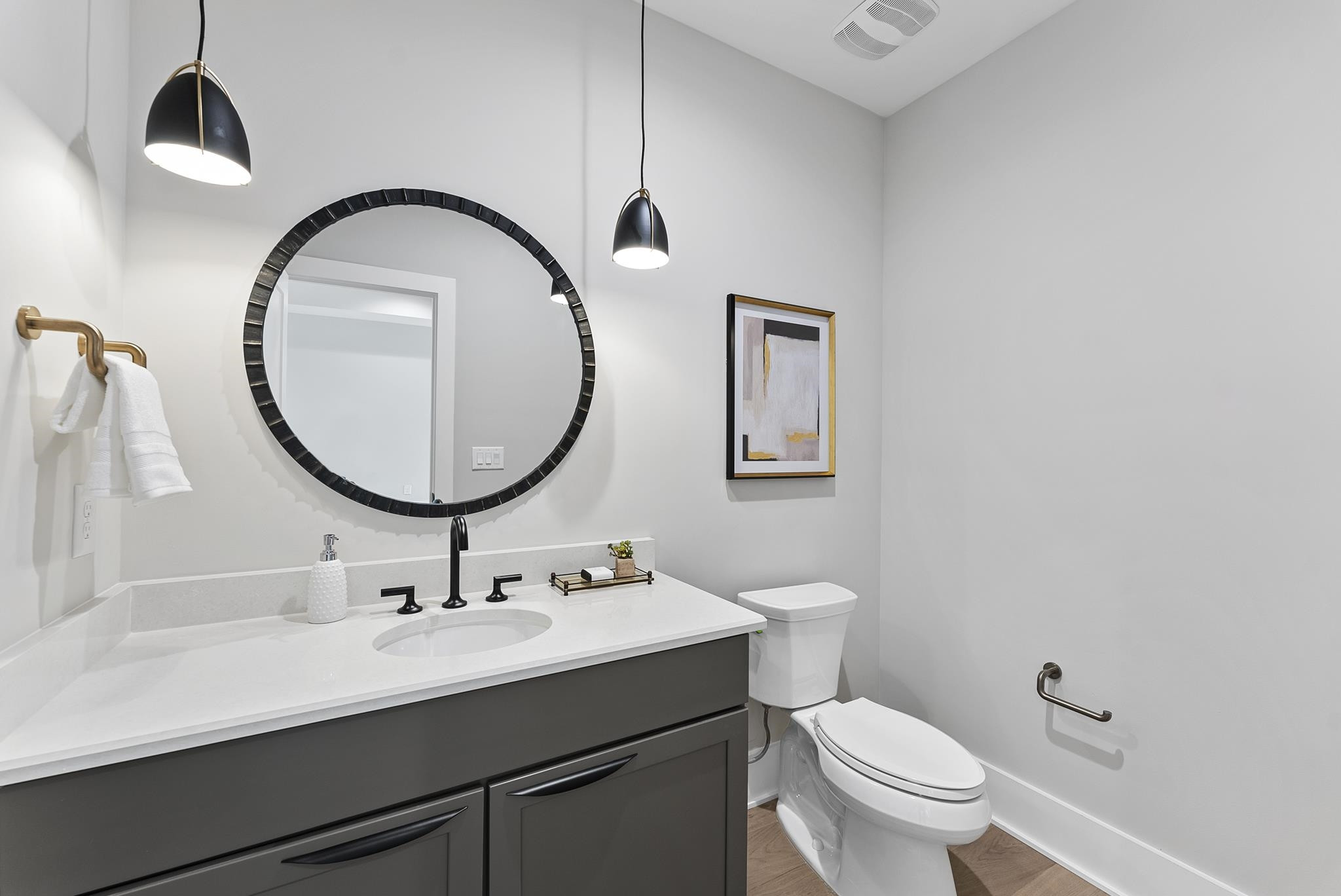 1001 Enchanted Pine Lane Raleigh, NC 27614 - Photo 42 of 52 a bathroom with a sink a toilet and a mirror