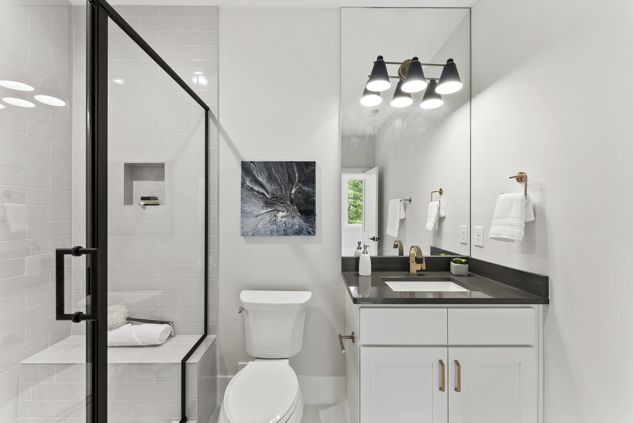 1001 Enchanted Pine Lane Raleigh, NC 27614 - Photo 50 of 52 a bathroom with a toilet a sink and mirror