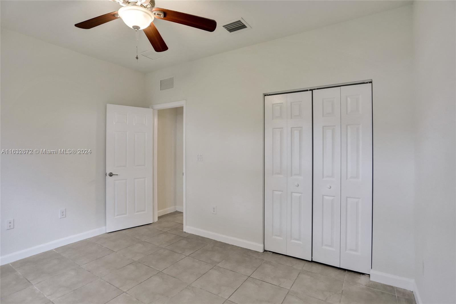 588 Southeast 35th Terrace Homestead, FL 33033 - Photo 14 of 37 an empty room with closet area