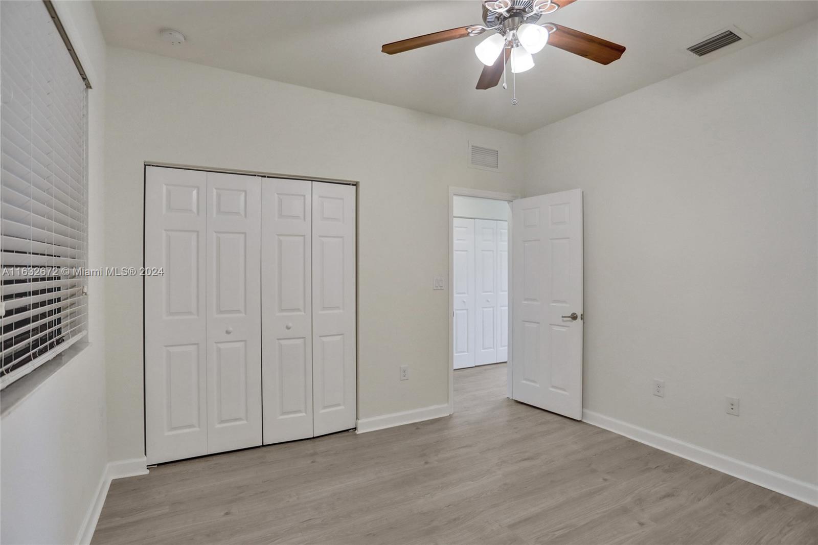 588 Southeast 35th Terrace Homestead, FL 33033 - Photo 20 of 37 wooden floor in an empty room
