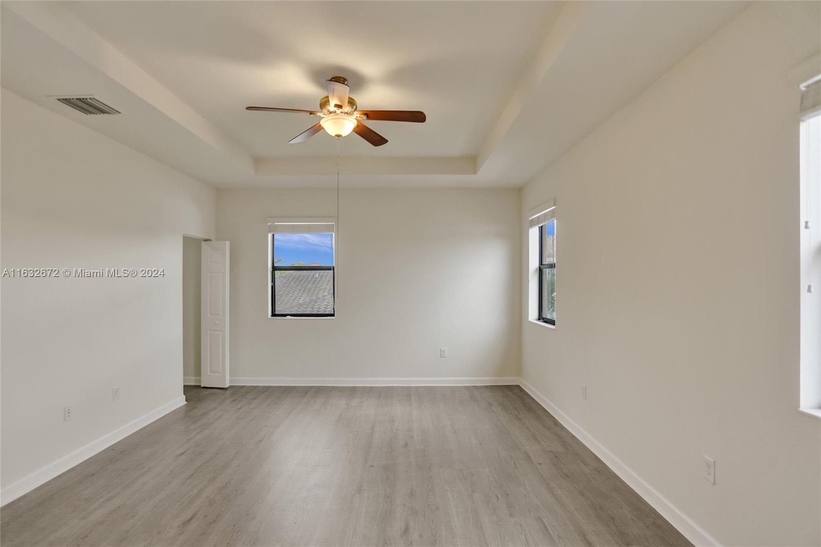 588 Southeast 35th Terrace Homestead, FL 33033 - Photo 22 of 37 wooden floor in an empty room with a window