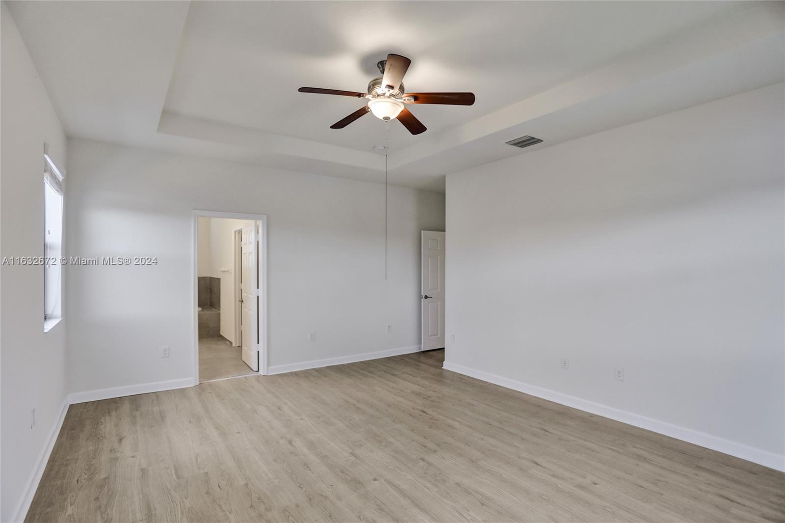 588 Southeast 35th Terrace Homestead, FL 33033 - Photo 23 of 37 a view of empty room with wooden floor