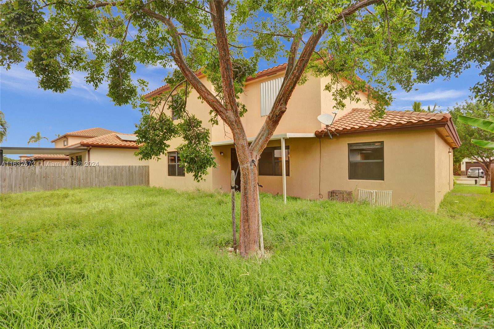 588 Southeast 35th Terrace Homestead, FL 33033 - Photo 27 of 37 a house is sitting in middle od the grass