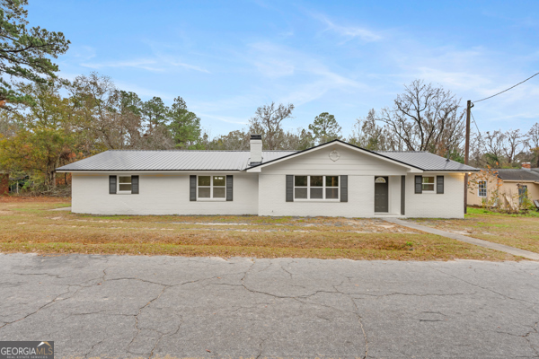 529 College Heights Road Portal, GA 30450 - Photo 1 of 23 a view of a house with a yard and large trees