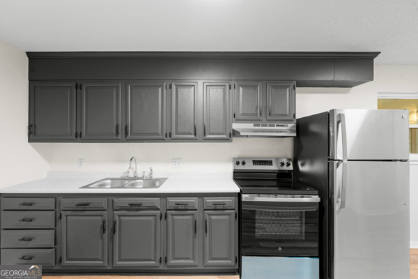 529 College Heights Road Portal, GA 30450 - Photo 12 of 23 a kitchen with stainless steel appliances granite countertop a refrigerator and a stove