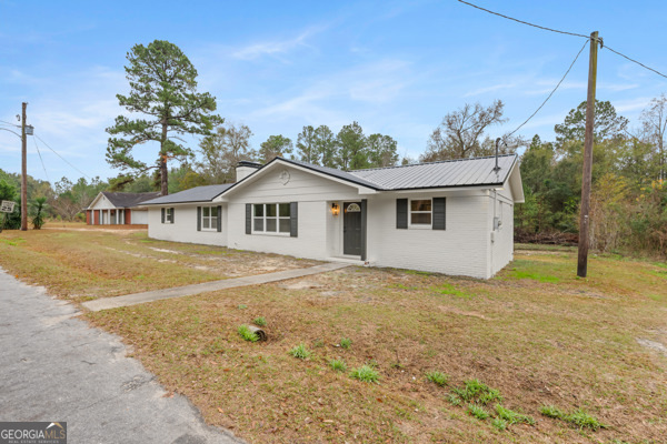 529 College Heights Road Portal, GA 30450 - Photo 2 of 23 a view of a house with a backyard