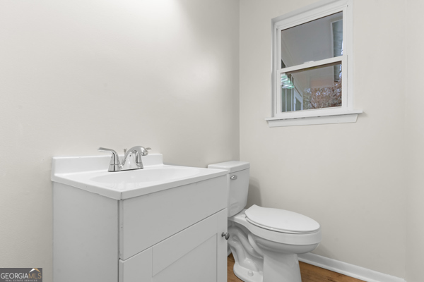 529 College Heights Road Portal, GA 30450 - Photo 21 of 23 a bathroom with a toilet a sink and mirror