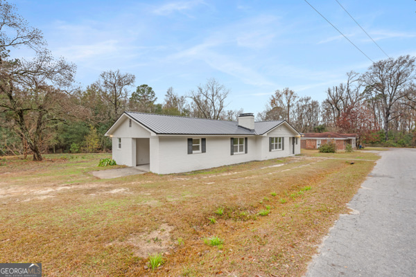 529 College Heights Road Portal, GA 30450 - Photo 3 of 23 a front view of a house with a yard