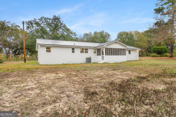 529 College Heights Road Portal, GA 30450 - Photo 4 of 23 a view of a house with a yard