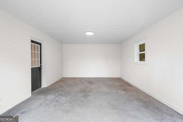 529 College Heights Road Portal, GA 30450 - Photo 6 of 23 an empty room with windows