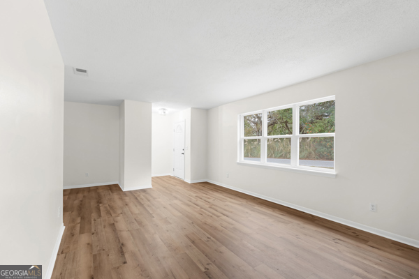 529 College Heights Road Portal, GA 30450 - Photo 9 of 23 a view of an empty room with a window