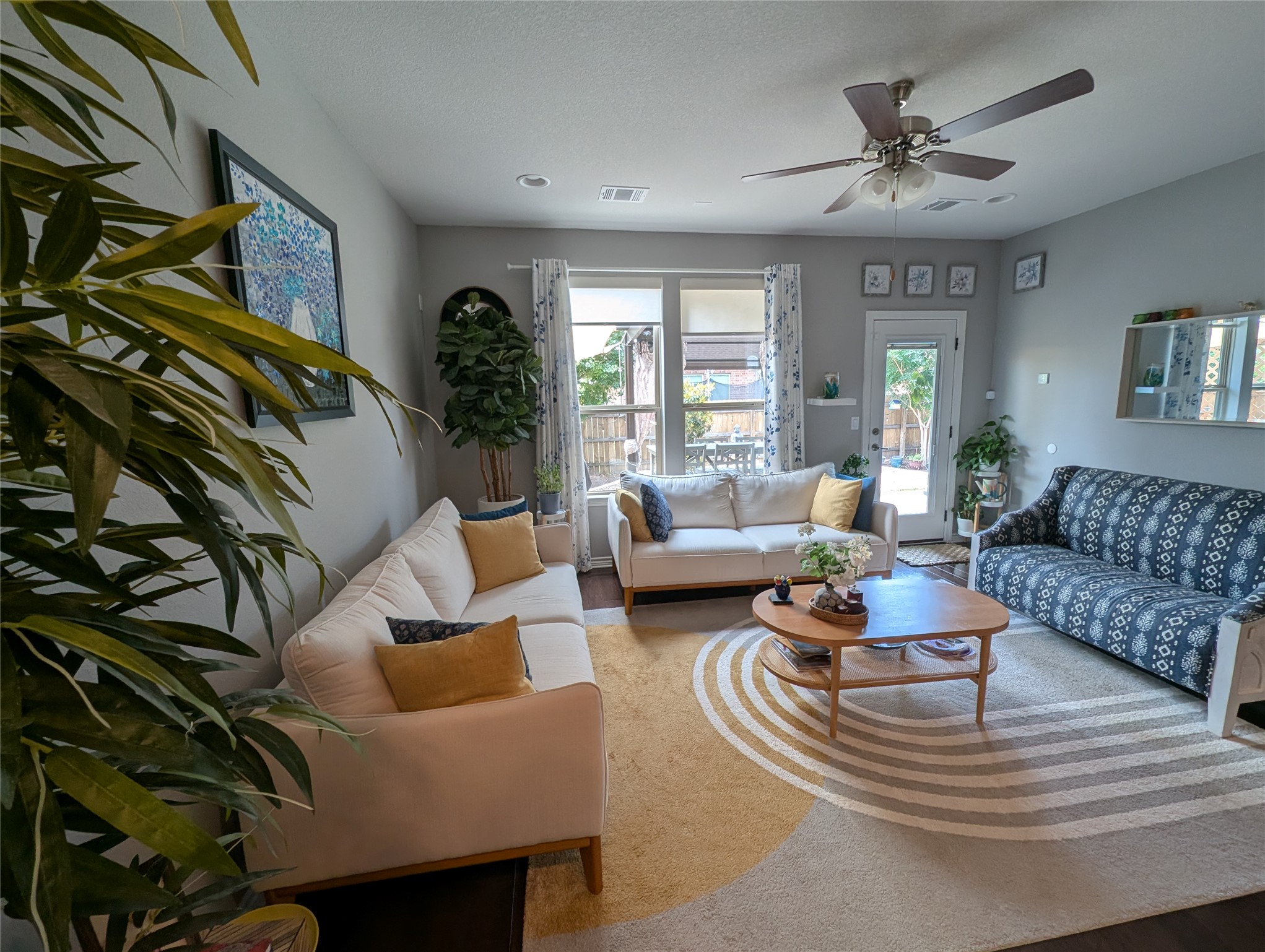 14502 McCoy Loop Austin, TX 78717 - Photo 6 of 26 Open-concept living space featuring wood-finish flooring, recessed lighting, and a ceiling fan with integrated lighting