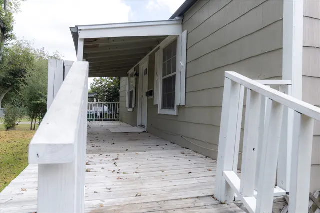 a view of backyard with small cabin and wooden fencing