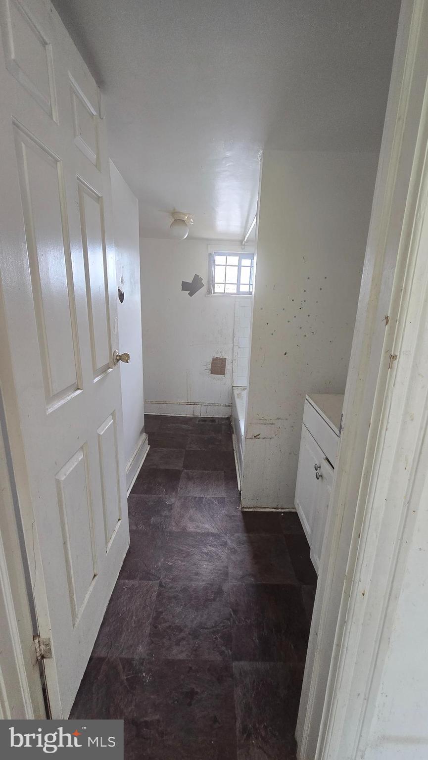 1126 Park Road Northwest Washington, DC 20010 - Photo 2 of 8 a view of a hallway with a washer and dryer