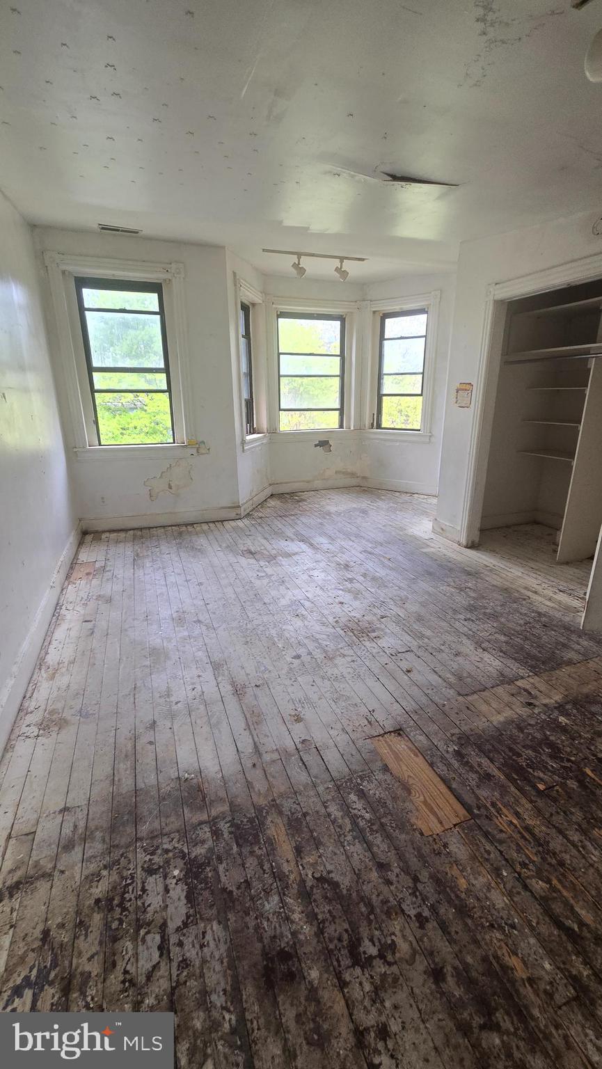 1126 Park Road Northwest Washington, DC 20010 - Photo 3 of 8 an empty room with windows