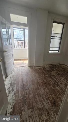 a view of an empty room and a window