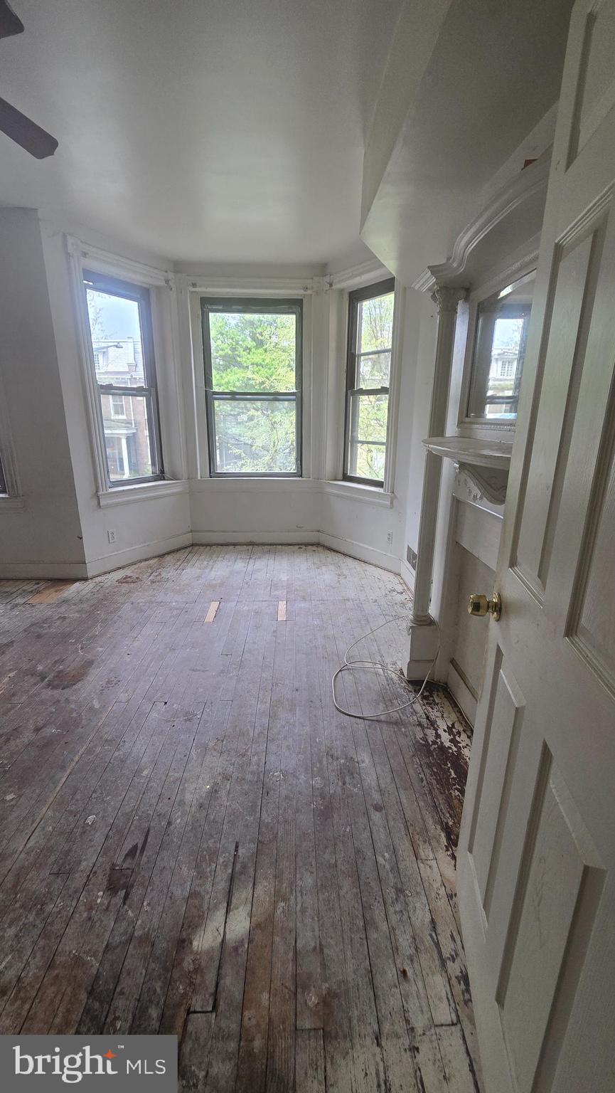 1126 Park Road Northwest Washington, DC 20010 - Photo 8 of 8 an empty room with windows
