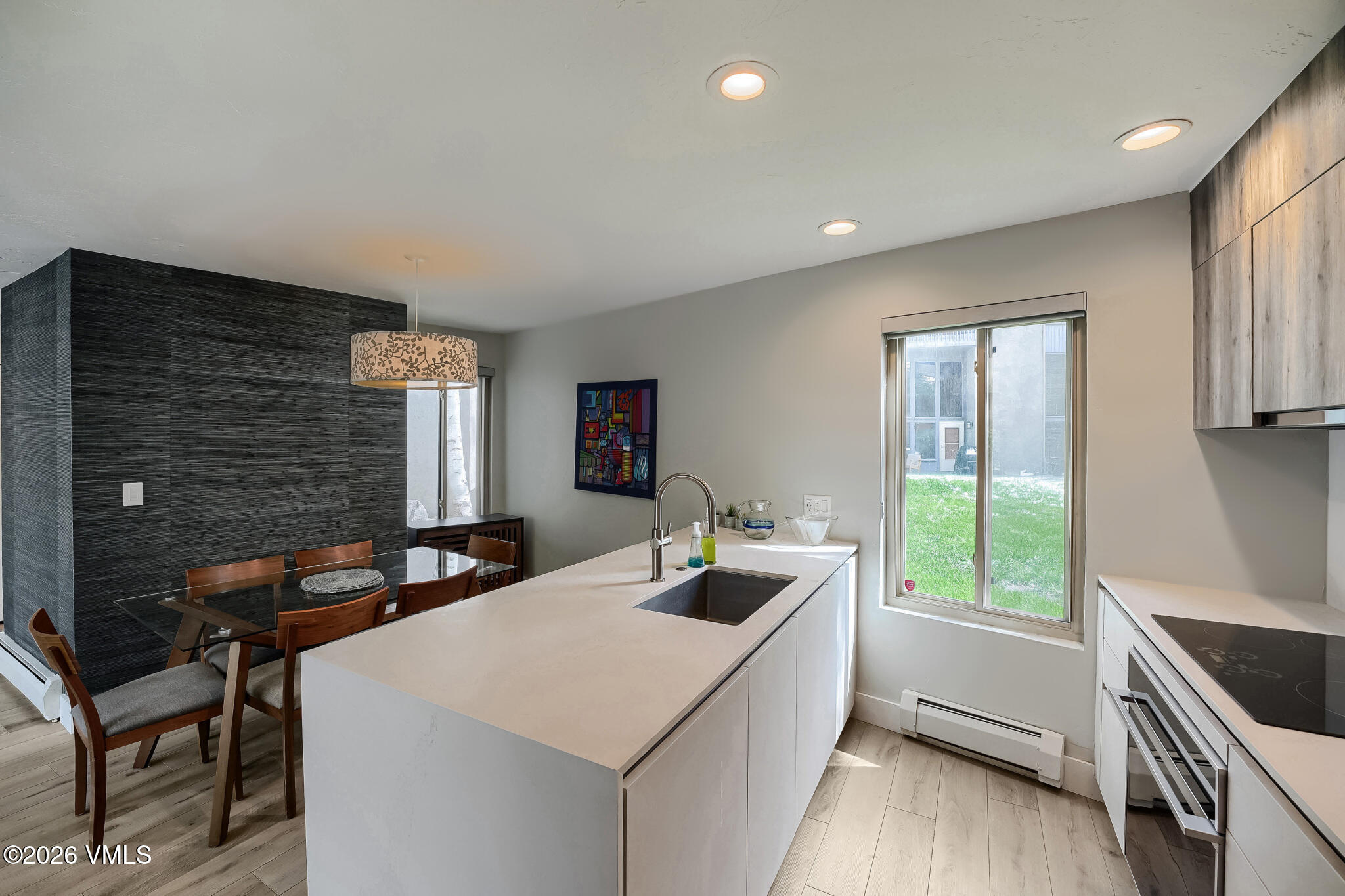 142 Eagle Drive, Unit C1 Avon, CO 81620 - Photo 8 of 20 a kitchen with a stove a sink and a wooden cabinets