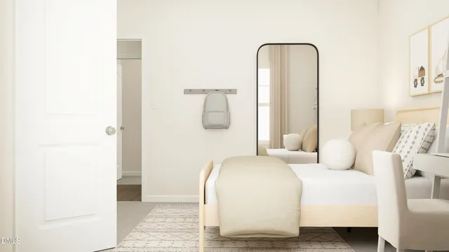 a bedroom with a bed and a mirror