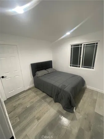 a bedroom with a large bed and a walk in closet