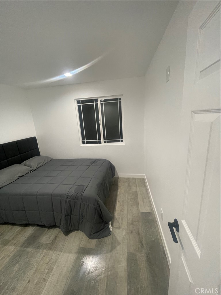 2588 Secret Drive Running Springs, CA 92382 - Photo 16 of 24 a bedroom with a bed and painting on the wall