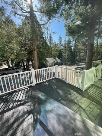 a view of deck with wooden floor and fence