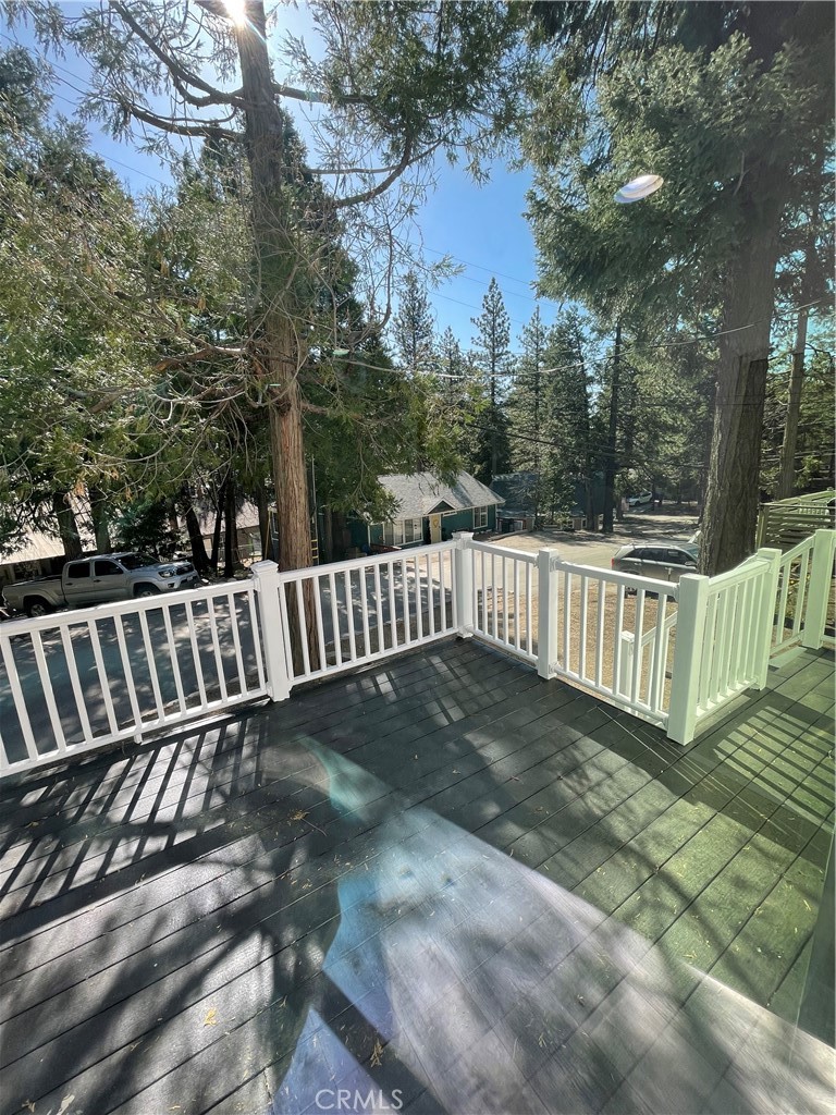 2588 Secret Drive Running Springs, CA 92382 - Photo 4 of 24 a view of deck with wooden floor and fence