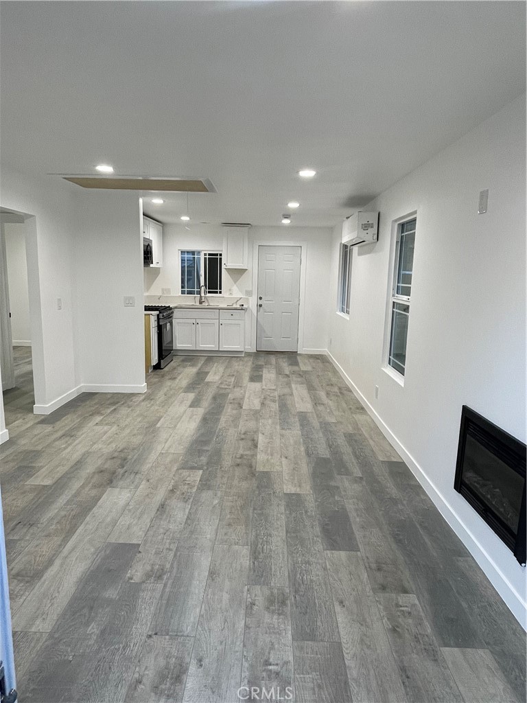 2588 Secret Drive Running Springs, CA 92382 - Photo 6 of 24 a view of a livingroom with an empty space and a window